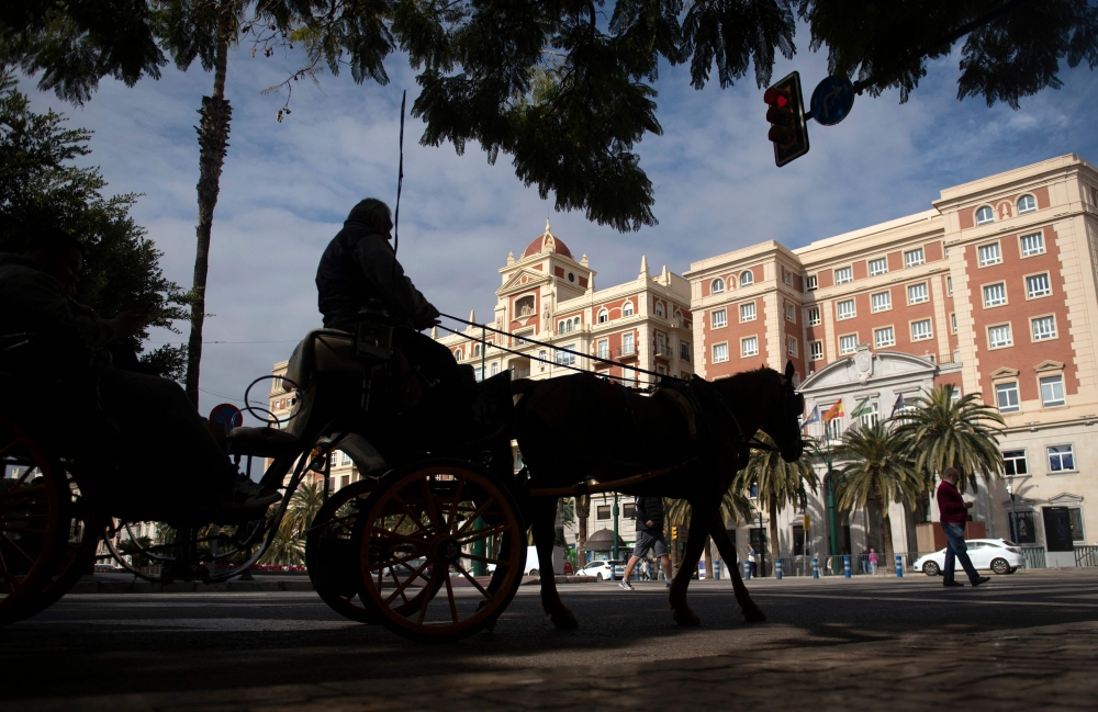 The Malaga City Council, with Francisco de la Torre as mayor, has reached an agreement with the 25 licensed coachmen to stop operating horse-drawn carriages for tourist use. — AFP pic