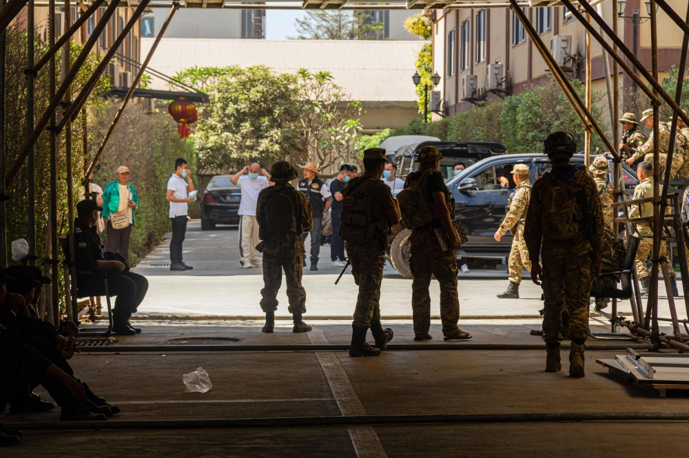 Members of the Karen Border Guard Force carry out an inspection at a work place during a crackdown operation on illicit activity linked to scam centres in Shwe Kokko in Myanmar’s eastern Myawaddy township on February 14, 2025. — AFP pic