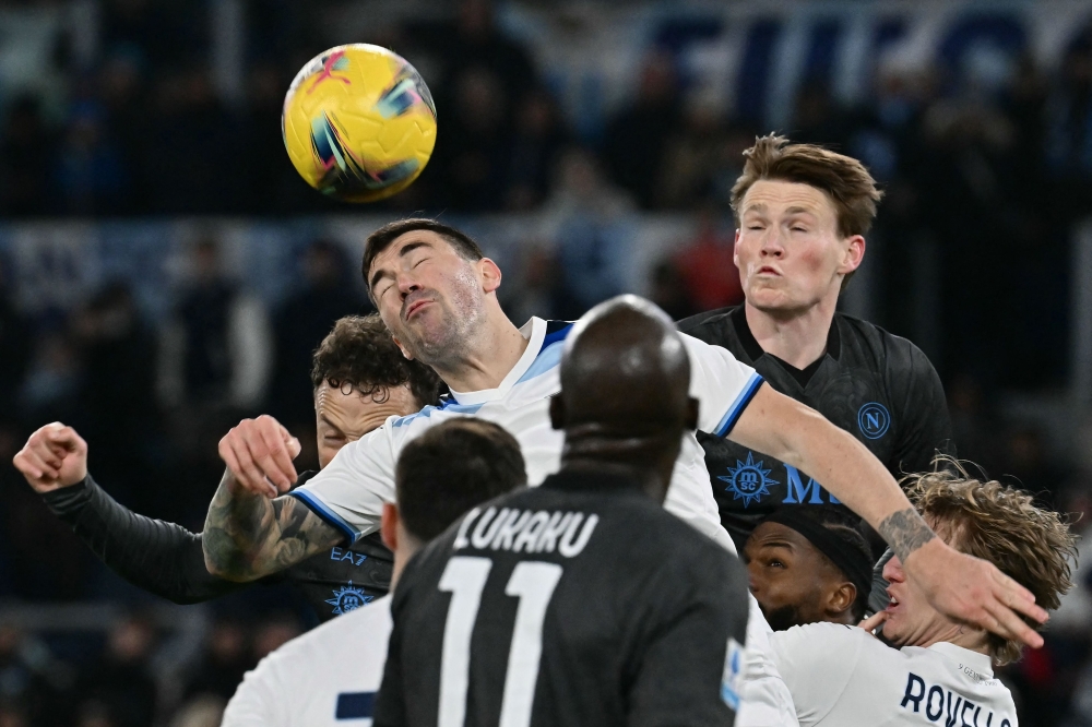 Lazio’s Mattia Zaccagni in a tussle for the ball. — Pic by AFP