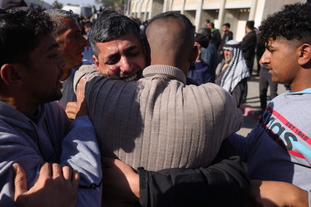 A former Palestinian prisoner, released as part of the sixth hostage-prisoner exchange, is welcomed by friends and relatives upon arriving at the European Hospital in Khan Yunis. — Pic by AFP