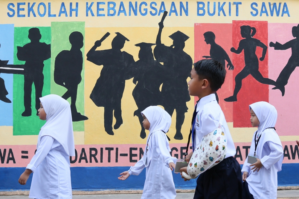 First year students of Sekolah Kebangsaan Bukit Sawa are seen on the first day of the 2025/2026 session February 16, 2025. — Bernama pic