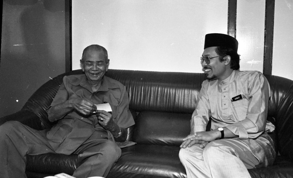 An undated photograph shows Datuk Seri Anwar Ibrahim meeting with the late Tunku Abdul Rahman Putra Al-Haj. — Picture from Facebook/Anwar Ibrahim