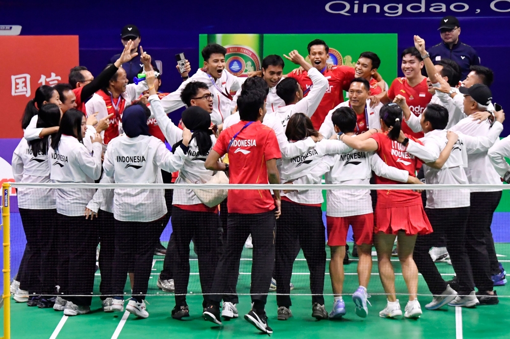 Members of Indonesia's team celebrate after winning the Badminton Asia Mixed Team Championships in Qingdao, in China's eastern Shandong province on February 16, 2025. — AFP pic