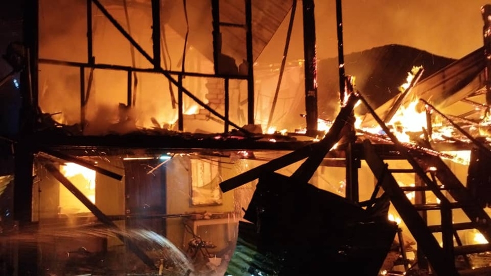 A total of 22 individuals, four of whom were children, from seven households in Kampung Tabuan Dayak were made homeless last night after their rented houses were razed by fire. — Picture courtesy of the Fire and Rescue Department 