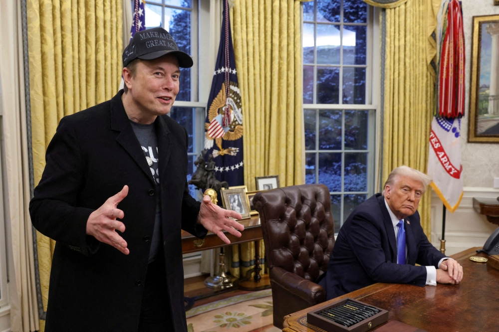 Elon Musk speaks next to US President Donald Trump in the Oval Office of the White House in Washington, DC, February 11, 2025. Spearheaded by Musk, the world’s richest man, Trump has embarked on a campaign to slash public spending deemed wasteful or contrary to his policies. — Reuters pic 