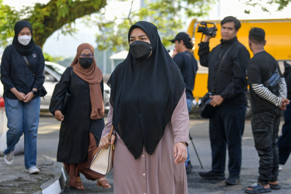 Zayn Rayyan's mother, Ismanira Abdul Manaf (centre) appeared in the Sessions Court for the trial of the neglect case faced by the parents of the autistic child in Petaling Jaya February 17, 2025. — Bernama pic