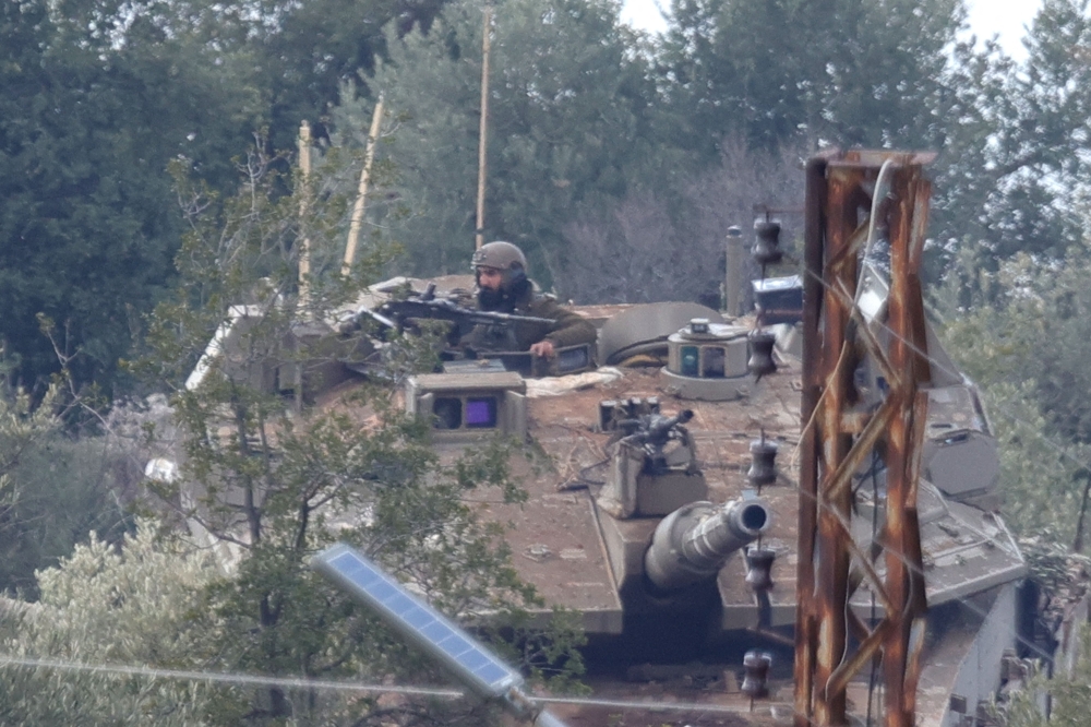Israeli army forces patrol in the village of Kfarshuba in southern Lebanon on February 17, 2025. — AFP pic