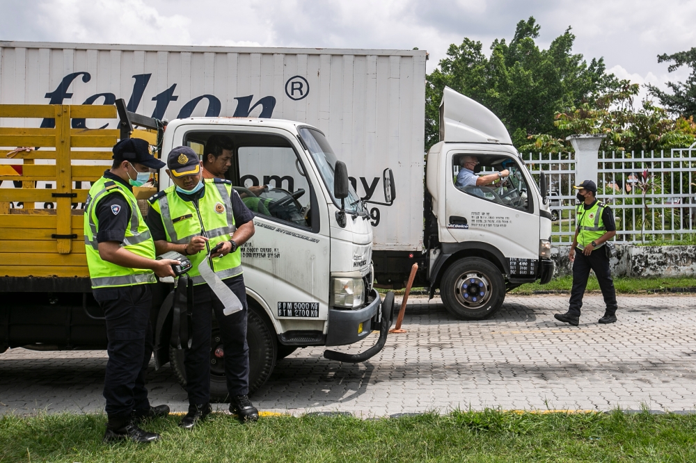 The Ministry of Transport will answer questions on the criteria for selecting three companies that will compete with Puspakom. — Picture by Hari Anggara