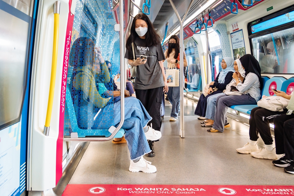 Passengers ride on a Mass Rapid Transit (MRT) train at Bandar Tun Hussein Station, Kuala Lumpur December 21, 2023. — Picture by Firdaus Latif