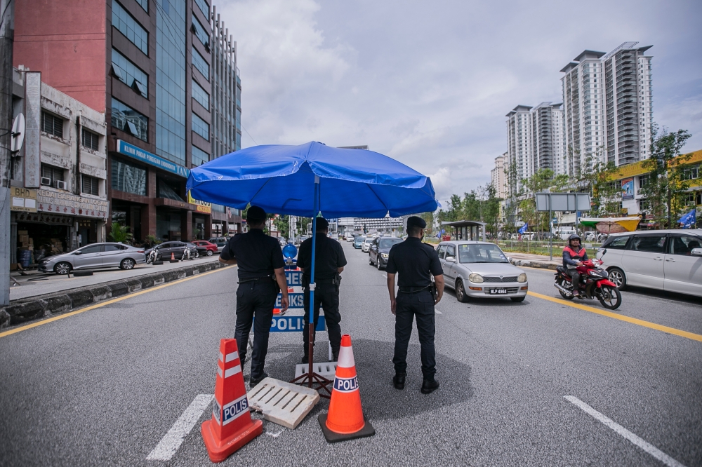 Police officers ranked Inspector and above are only authorised to inspect mobile phones under reasonable suspicion and in accordance with existing laws. — Picture by Hari Anggara