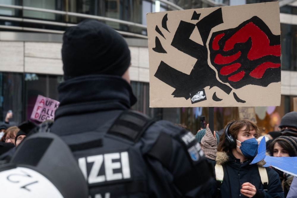 People protest against the far-right Alternative for Germany (AfD) party in Duesseldorf, Germany February 15, 2025. — Reuters pic