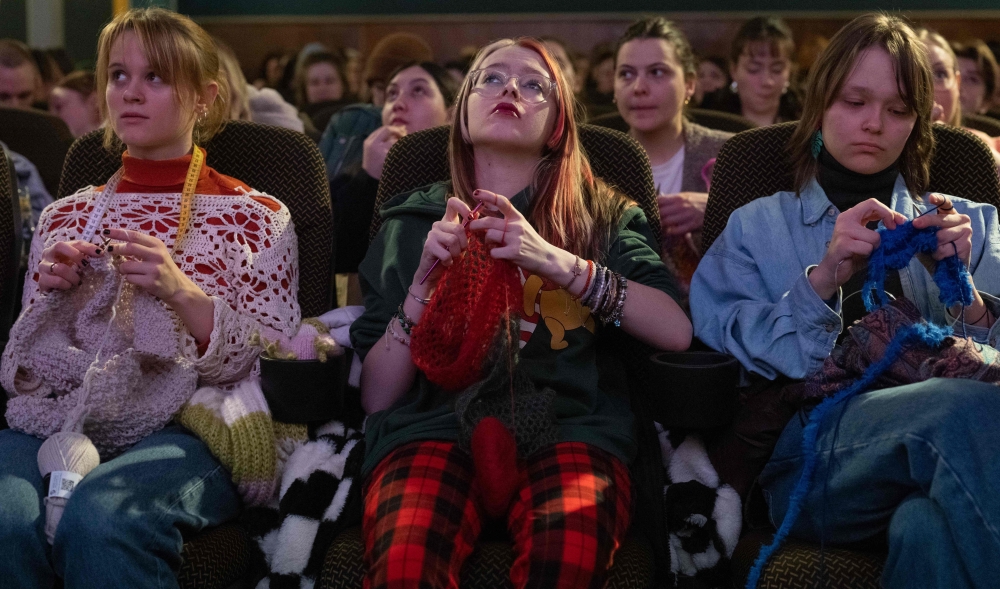 Women knit during the projection of the movie ‘The Devil Wears Prada’ at the Votive Cinema in Vienna February 16, 2025. — AFP pic