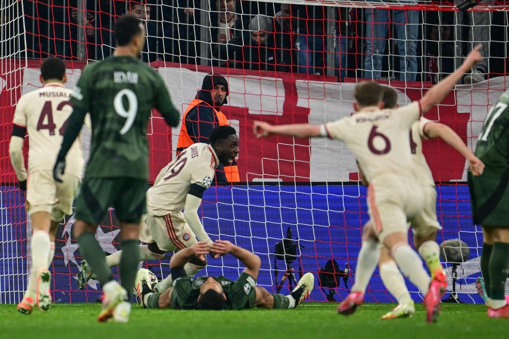 Bayern Munich’s Canadian defender #19 Alphonso Davies celebrates scoring the 1-1 goal during the Uefa Champions League second-leg, knockout phase play-off match FC Bayern Munich vs Celtic on February 18, 2025 in Munich. — AFP pic 
