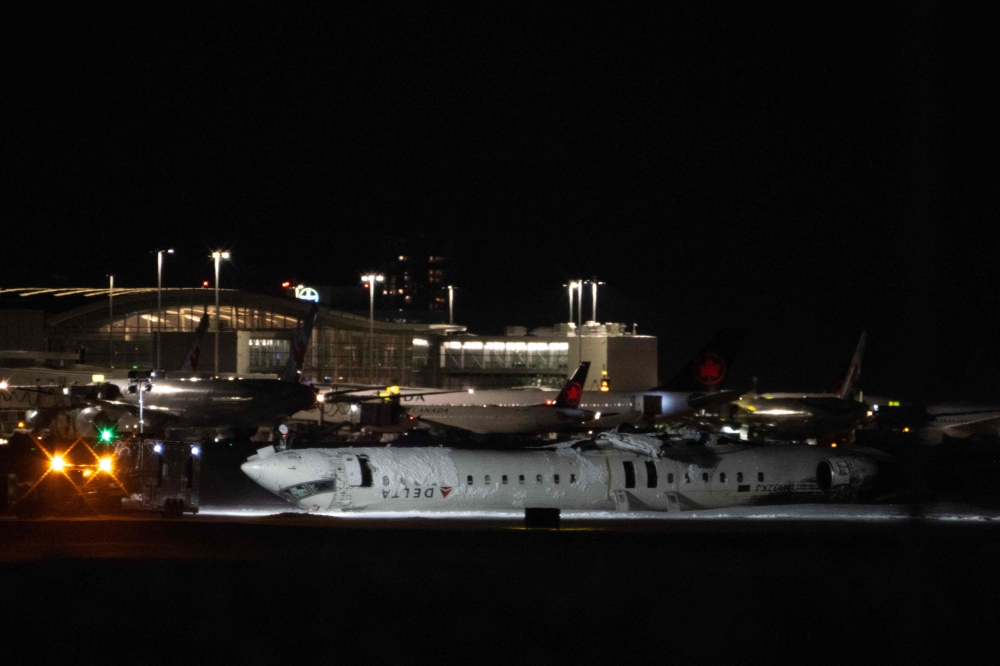 The Delta Air Lines plane that crashed and injured at least 18 passengers at Toronto Pearson International Airport  attempted to land amid strong winds and snow. – Pic by AFP 