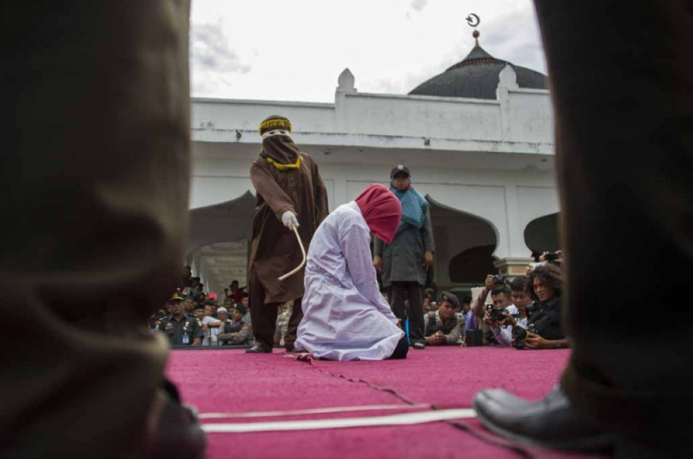 Malaysia’s public caning for Shariah offences is carried out in a closed setting outside prison compared to in Aceh, Indonesia where the sentence is executed openly before huge crowds like a spectacle. — AFP file pic