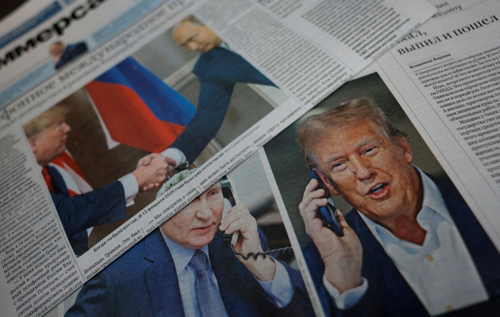Daily newspapers with covers, dedicated to the recent phone call of Russian President Vladimir Putin and U.S. President Donald Trump, are laid out at a newsstand in a street in Moscow, Russia, February 13, 2025. — Reuters pic