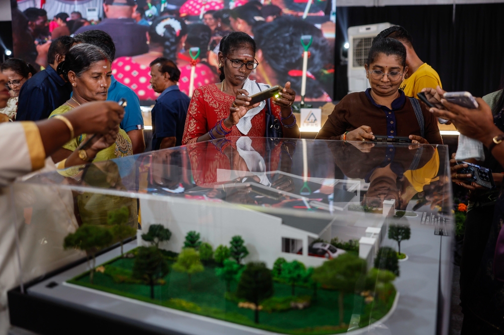 People view a house model at the Madani Harmoni People’s Residency Program (PRR) in Bestari Jaya, Selangor on February 15, 2025. — Bernama pic