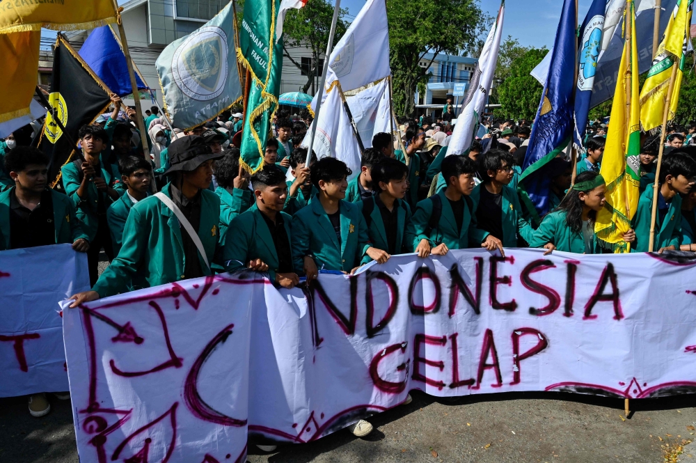 University students hold a rally titled Indonesia Gelap, Dark Indonesia, to oppose budget-cutting policies by Indonesian President Prabowo Subianto in front of the Aceh House of Representatives building in Banda Aceh on February 19, 2025. — AFP pic