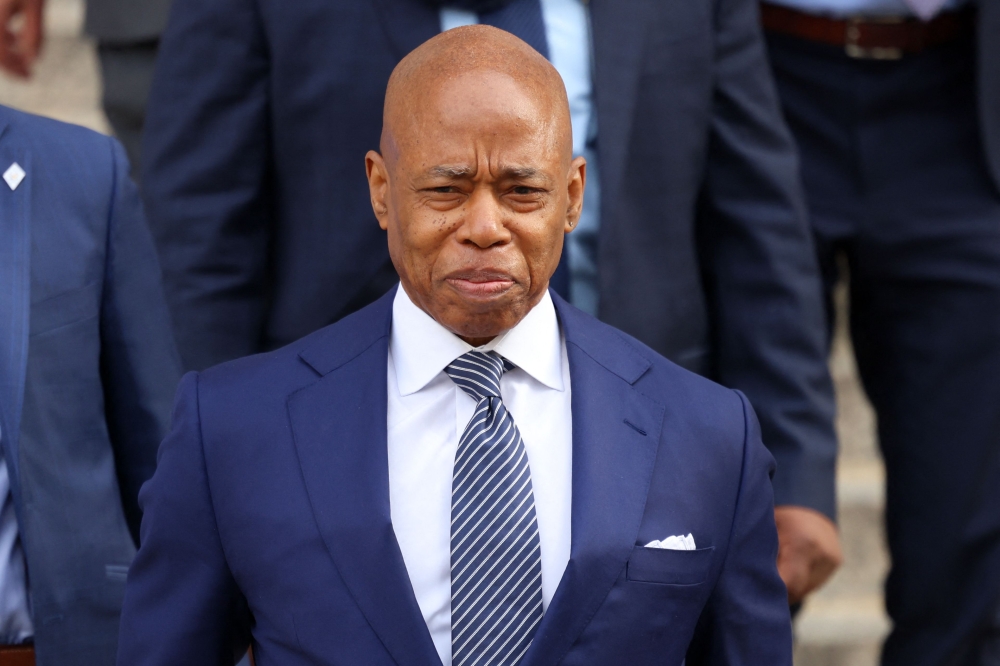 New York City Mayor Eric Adams departs after the court hearing on the Justice Department motion to drop criminal charges against him. — Pic by AFP