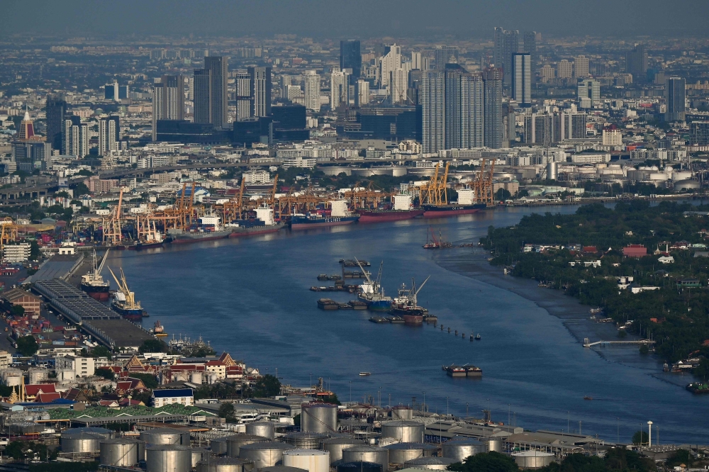 File picture taken on May 14, 2024 shows the skyline in the backdrop of the Bangkok Port as seen from the Mahanakhon Tower Observation deck in Bangkok. Thailand’s industrial confidence rose in January to its highest level in 10 months, driven by exports, government stimulus measures, and tourism, Xinhua reported, citing data on Wednesday. — AFP pic 