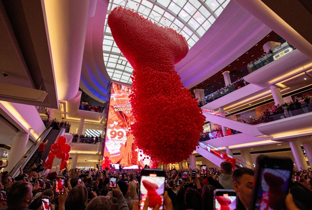 People watch as 99,000 balloons are released from a giant heart-shaped net during Valentine's Day celebrations at the Riviera shopping mall in Moscow, Russia February 14, 2025. — Reuters pic