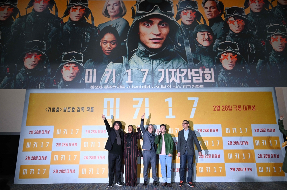South Korean director Bong Joon-ho, British actress Naomi Sarah Ackie, American actor Mark Alan Ruffalo, South Korean-American actor Steven Yeun and South Korean producer Choi Doo-ho pose for a photo during a press conference to promote the film 'Mickey 17' in Seoul on February 20, 2025. — AFP pic