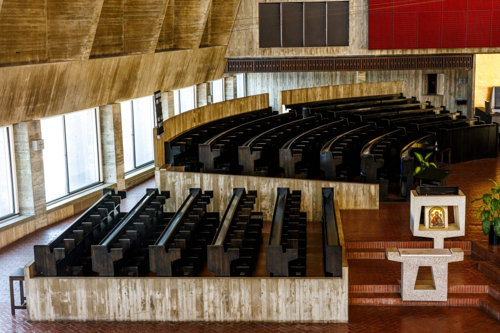 The choir stalls and pews of Saint John's Abbey in Collegeville, Minnesota, are arranged in a semicircular design, emphasizing communal worship and the Benedictine tradition of choral prayer. — AFP