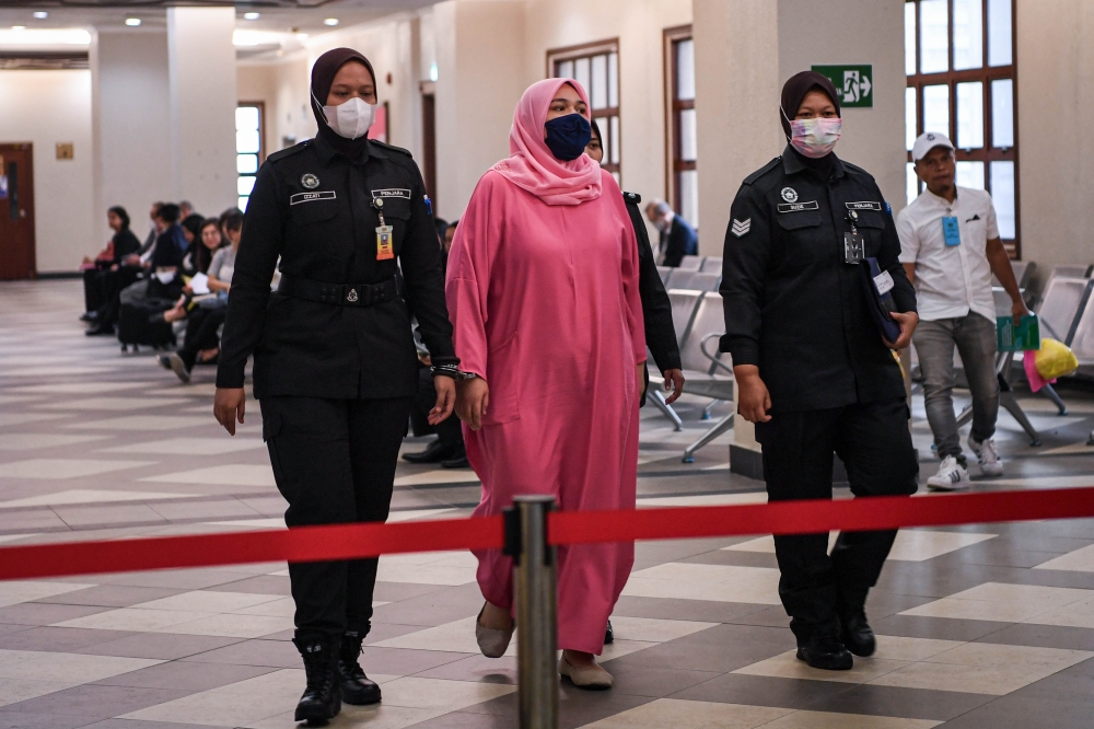 Rumah Bonda founder Siti Bainun Ahd Razali (centre) was previously sentenced to 12 years imprisonment after finding her guilty on two charges of neglecting and abusing the 13-year-old teenager. — Bernama pic