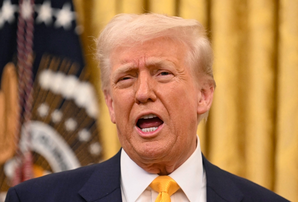 Donald Trump said yesterday that Ukraine’s Volodymyr Zelensky and Russia’s Vladimir Putin will have to “get together” to end the war between Moscow and Kyiv. — Pic by AFP