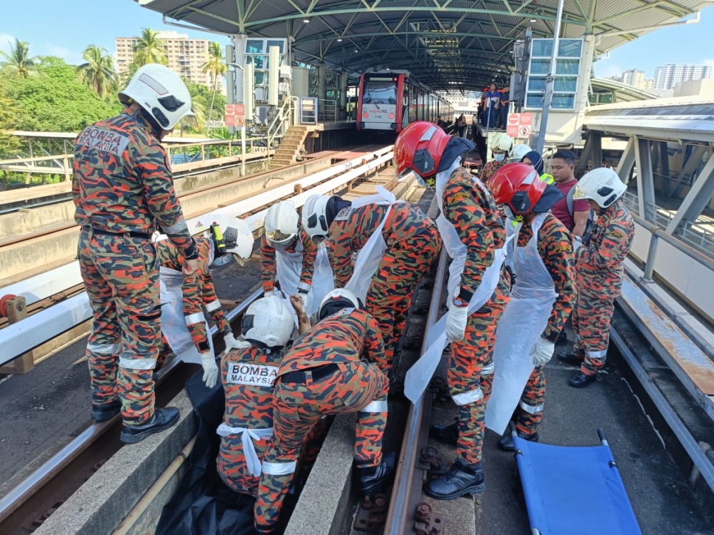 A body was found beneath the tracks at Titiwangsa LRT station this morning. — Picture courtesy of KL Fire and Rescue Department