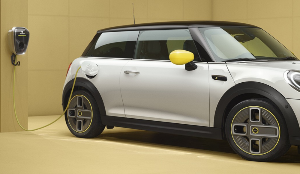 A promotional image shows a Mini Cooper Electric attached to a charging point. — Mini Malaysia pic