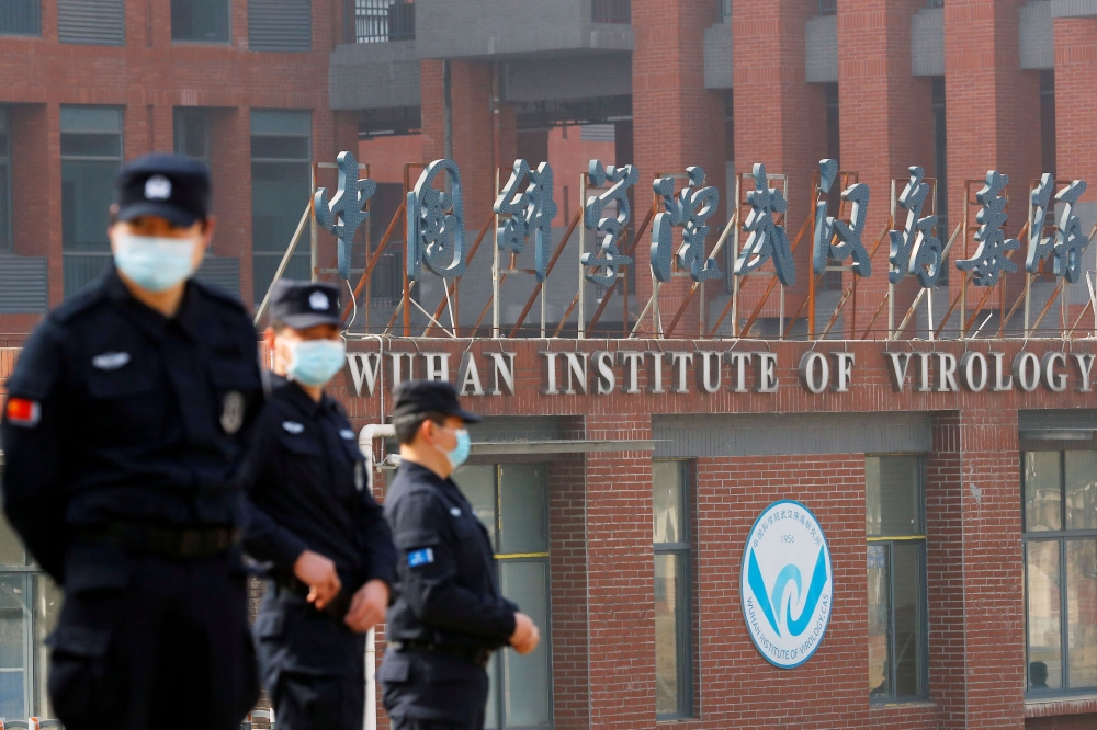 Security personnel keep watch outside Wuhan Institute of Virology during the visit by the World Health Organization in February 3, 2021. — Reuters file pic