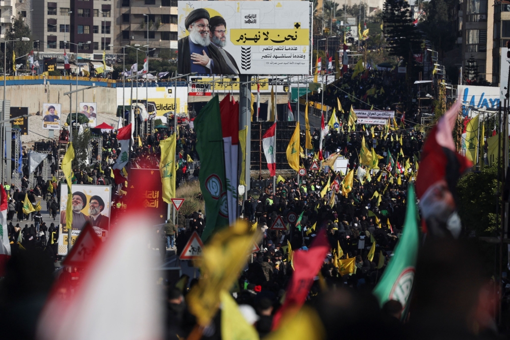 Tens of thousands of mourners dressed in black, some waving Hezbollah flags or carrying portraits of the group’s slain leader Hassan Nasrallah, flocked to his funeral Sunday in a stadium on the outskirts of Beirut. — Reuters pic