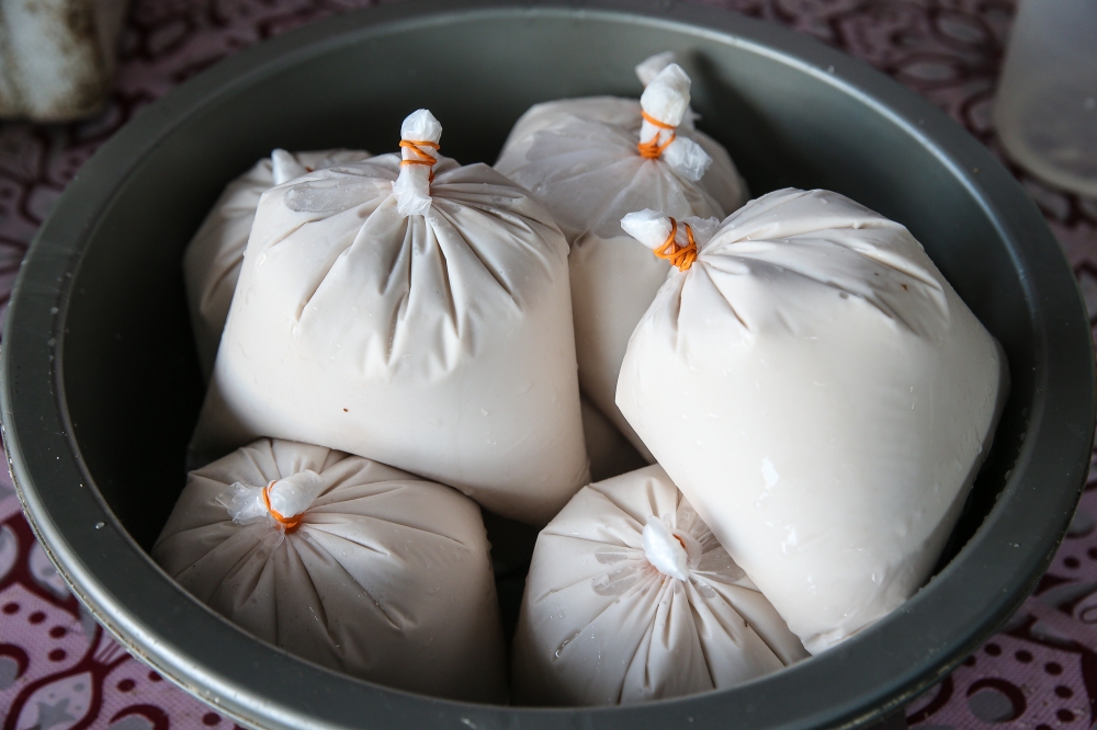 Coconut milk or ‘santan’ as it is locally called, is currently sold between RM8 to RM14 per kg at Pasar Datuk Keramat, but some traders say it has hit RM20 per kg in many parts of the country. — Picture by Yusof Mat Isa