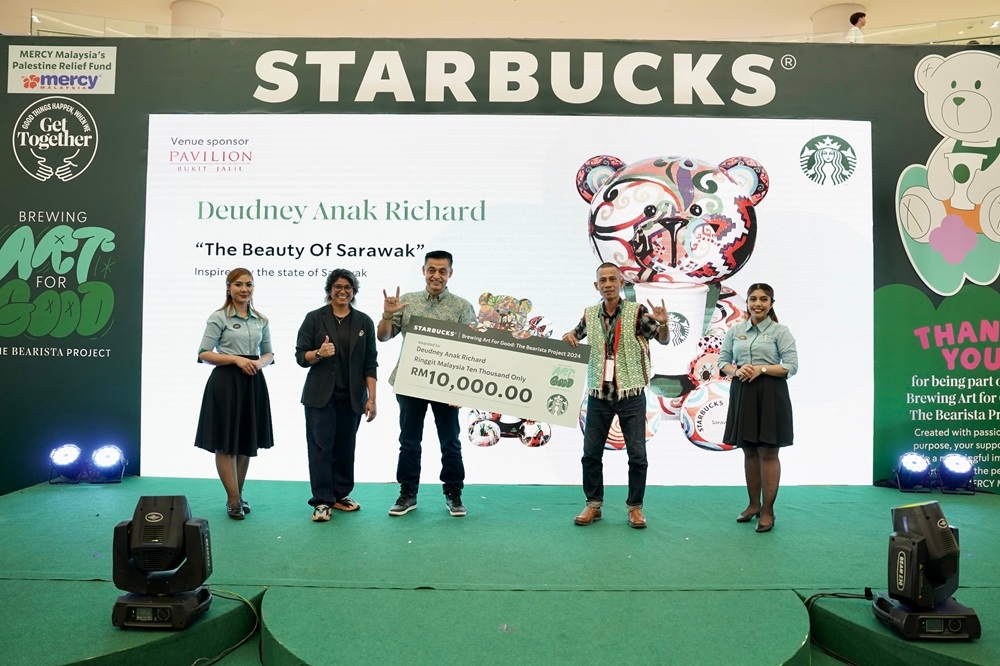Starbucks Malaysia Director of Marketing and Loyalty Zakiah Hanim, Berjaya Food Berhad and Starbucks Malaysia Group CEO and Managing Director Datuk Sydney Quays and deaf artist Deudney Anak Richard. — Picture courtesy of Starbucks Malaysia