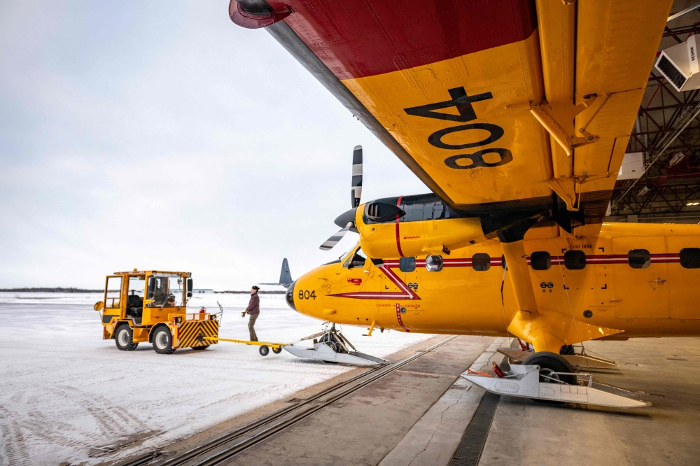 A Royal Canadian Air Force CC-138 Twin Otter is towed out of the hanger before a flight at Yellowknife Airport, Northwest Territories, Canada, on January 24, 2025. — AFP pic
