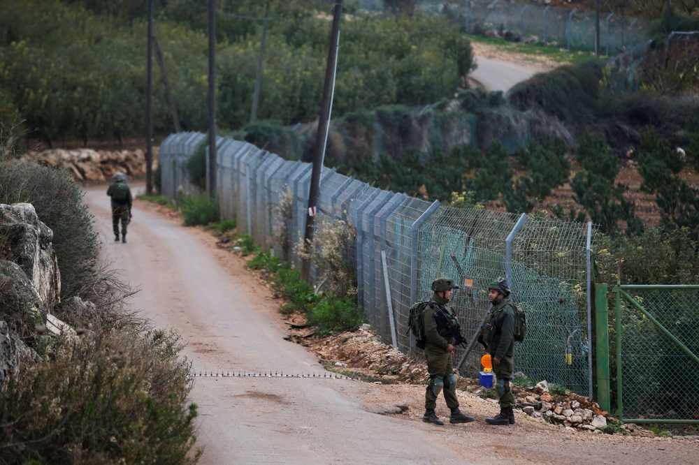 File picture of Israeli soldiers guarding near the border with Lebanon, in the town of Metulla, northern Israel December 4, 2018. — Reuters pic 
