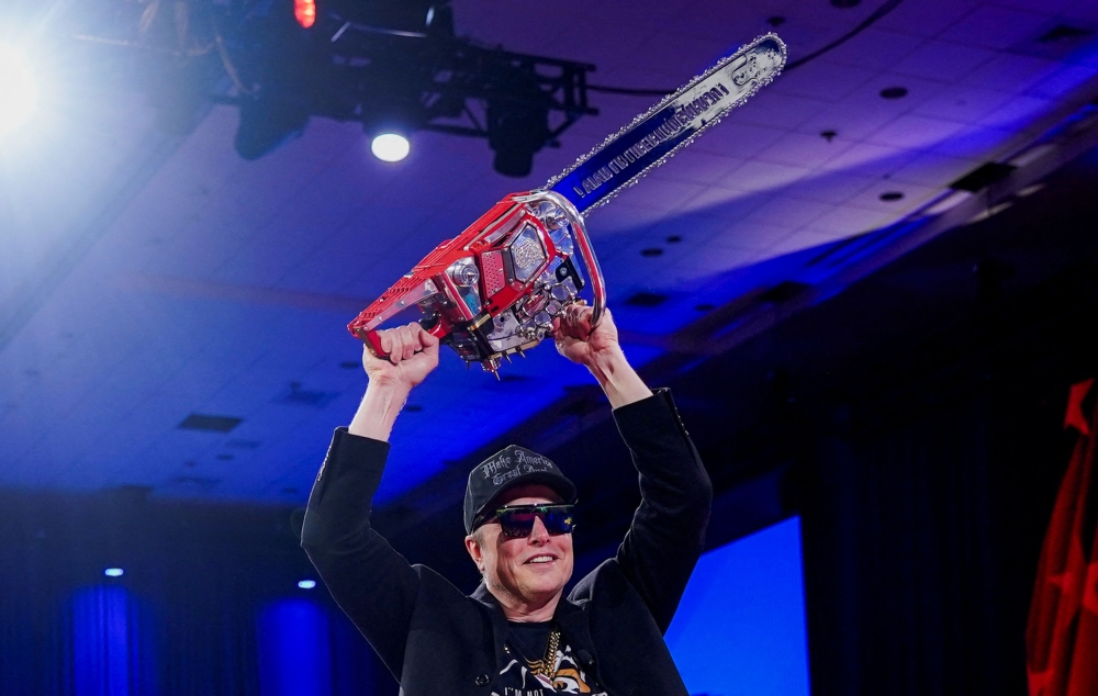 Elon Musk holds a chainsaw onstage as he attends the Conservative Political Action Conference (CPAC) in National Harbor, Maryland, US, February 20, 2025. — Reuters pic 