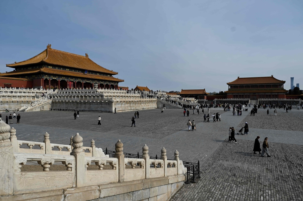 People visit the Forbidden City in Beijing on February 21, 2025. — AFP pic