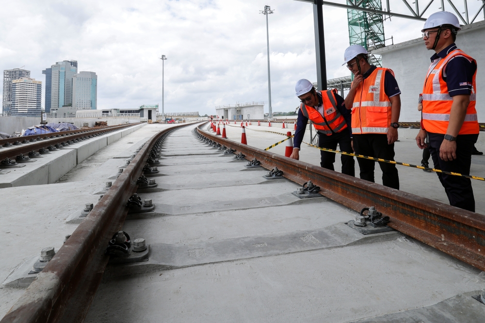 RTS Operations chief executive officer Dr Ahmad Marzuki Ariffin, Ir Zulkifli Mohamed, and RTS Operations project director Zahrin Abdul Ghani inspecting the rail system under construction during the Briefing Session on the Latest Developments of the RTS Link Project. — Bernama pic