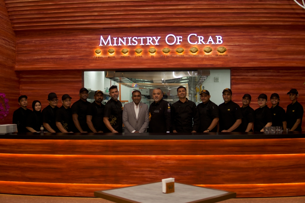 Chef Dharshan Munidasa and Sri Lankan cricket legend Mahela Jayawardene (in grey) with the team at Ministry of Crab, Kuala Lumpur. -- Picture courtesy of Ministry of Crab
