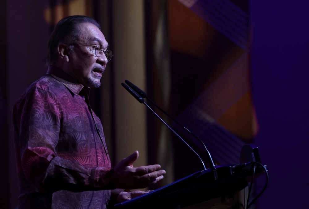 Prime Minister Datuk Seri Anwar Ibrahim delivers a speech during the launch of the National Waqf Month at the Putrajaya International Convention Centre (PICC) today. — Bernama pic