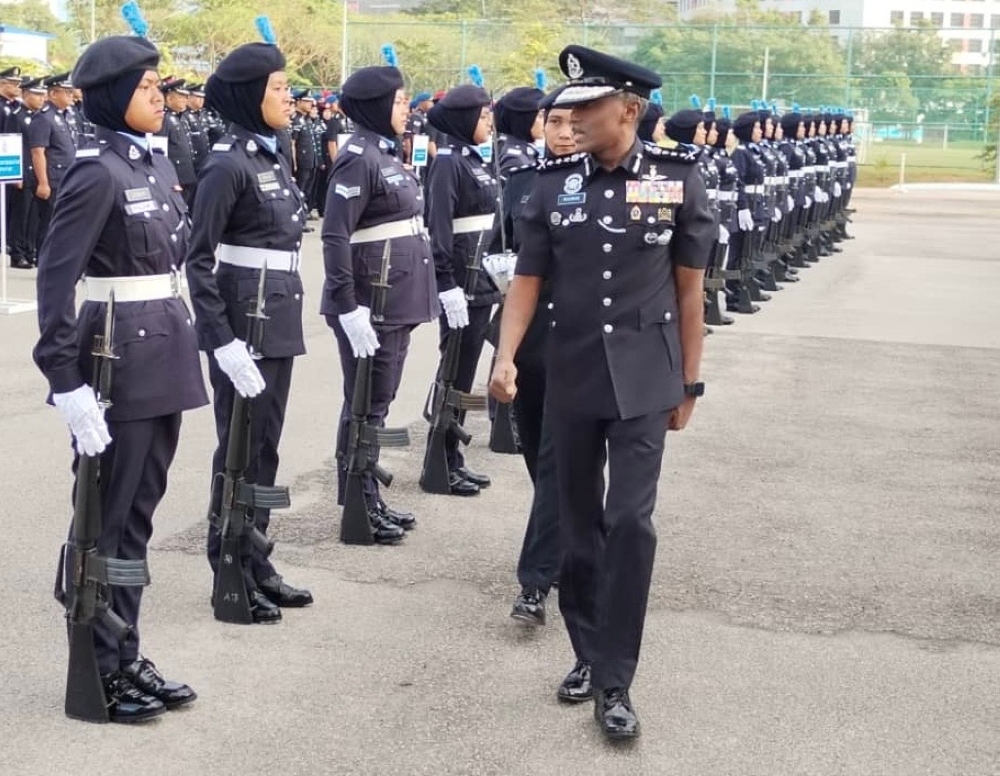 Johor police chief Datuk M. Kumar inspecting the guard-of-honour during the Johor police force’s monthly assembly at its state contingent headquarters. — Picture by Ben Tan