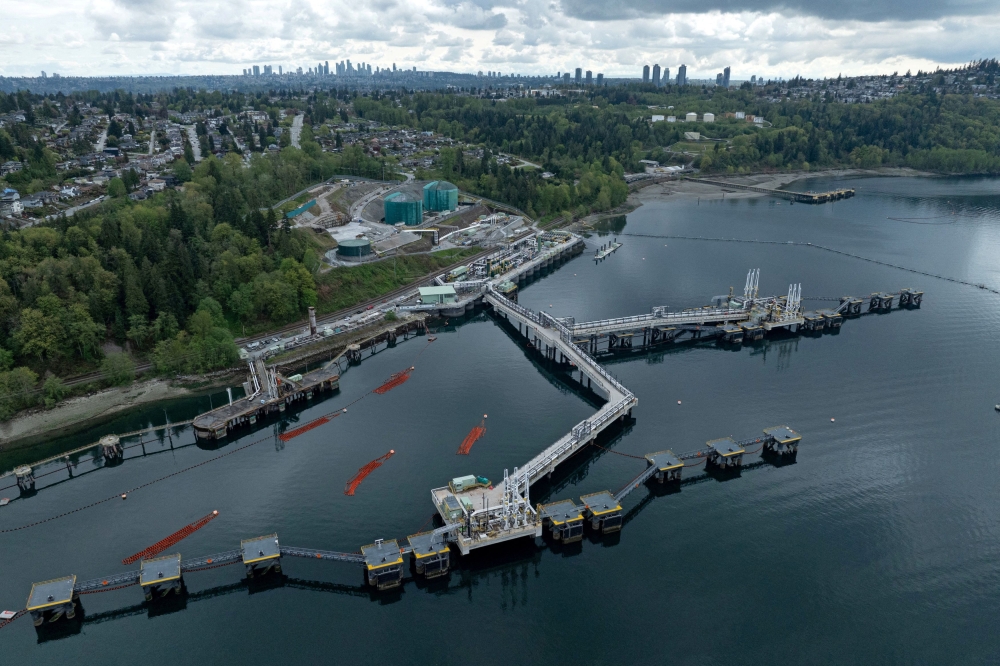 A drone view of three berths able to load vessels with oil is seen after their construction at Westridge Marine Terminal, the terminus of the Canadian government-owned Trans Mountain pipeline expansion project in Burnaby, British Columbia, Canada, April 26, 2024. — Reuters pic