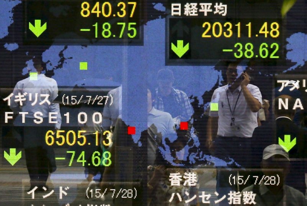 Asian markets tracked losses across the world as US President Donald Trump’s volley of tariff measures sparked fresh fears about a global trade war. — File pic by Reuters