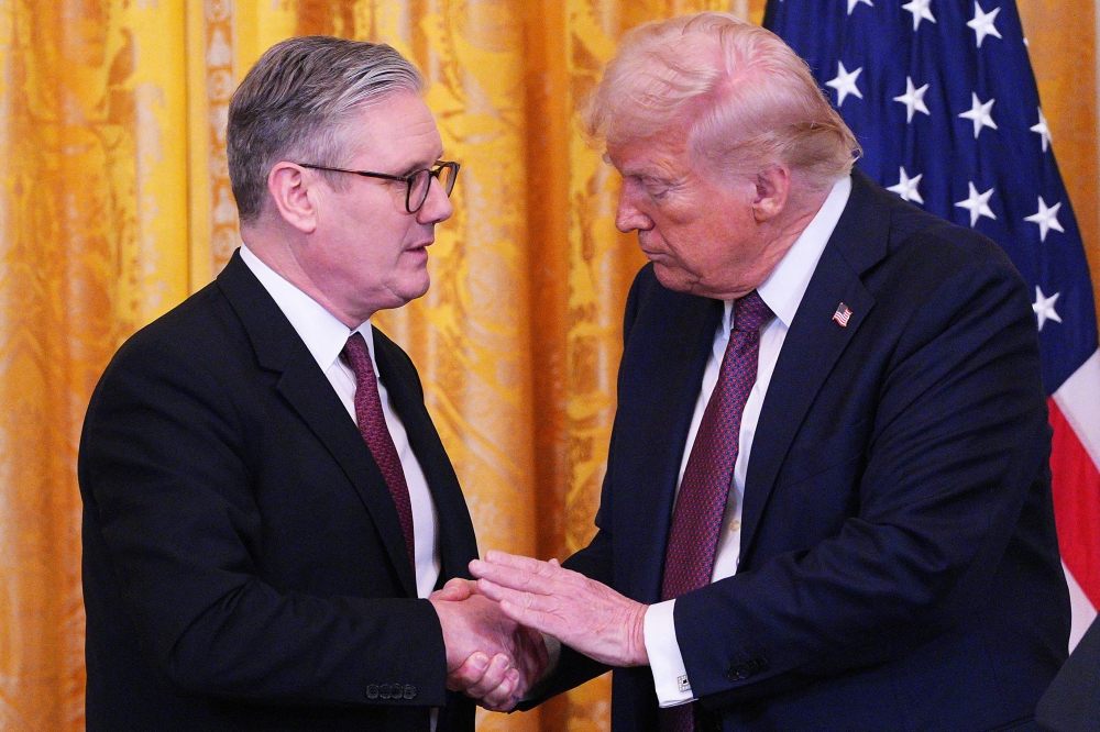 US President Donald Trump and British Prime Minister Keir Starmer during a joint press conference in the East Room of the White House in Washington. — Pic by AFP