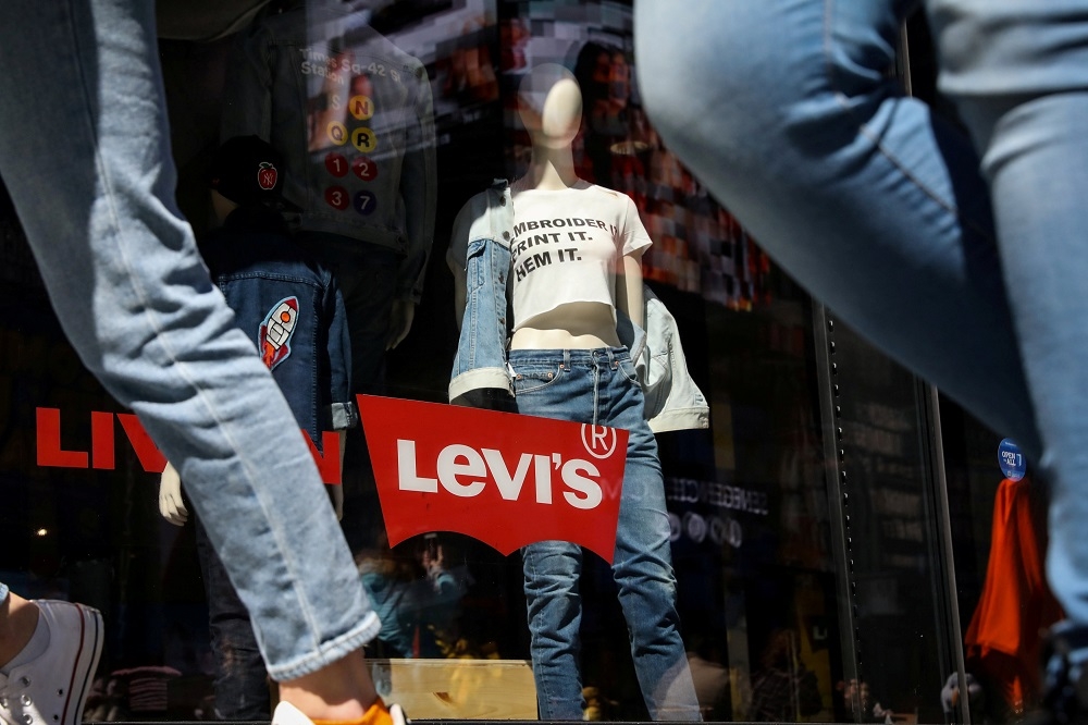 People pass by a Levi Strauss store in New York City March 19, 2019. — Reuters pic