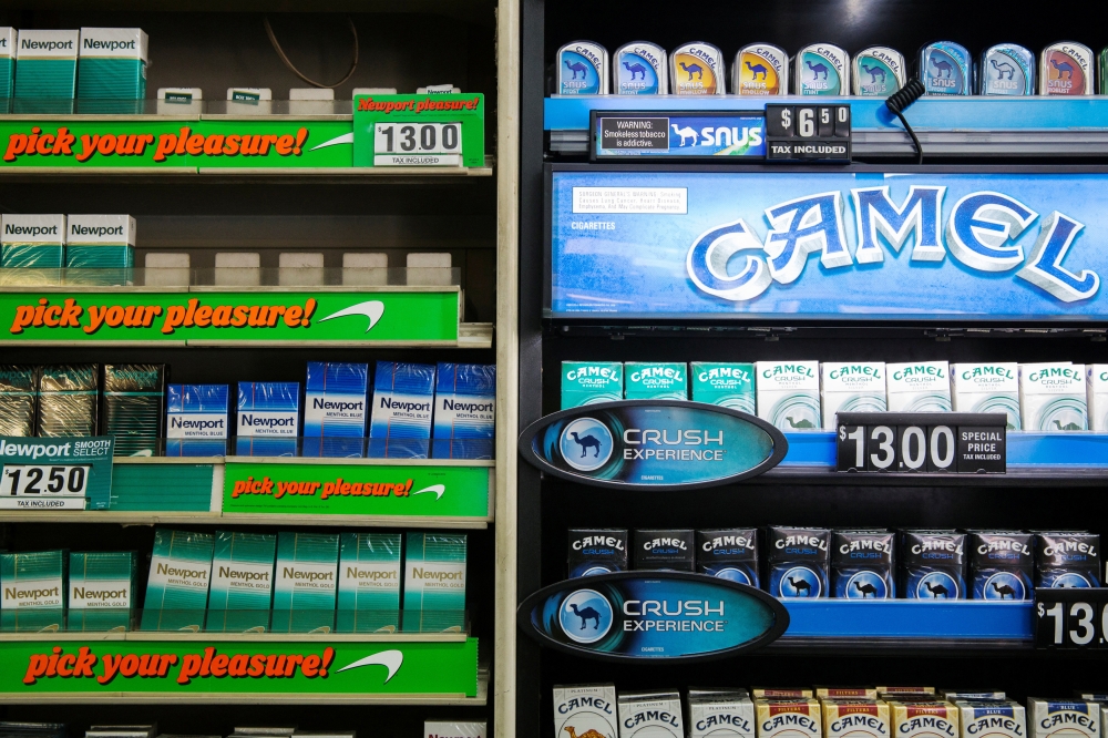 Cigarettes are stacked on a shelf inside a tobacco store in New York July 11, 2014. — Reuters pic