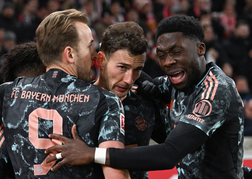 Bayern Munich’s Leon Goretzka (second from right) celebrates scoring his team’s second goal with team mate Harry Kane (second from left) and others against VfB Stuttgart. — Pic by AFP 