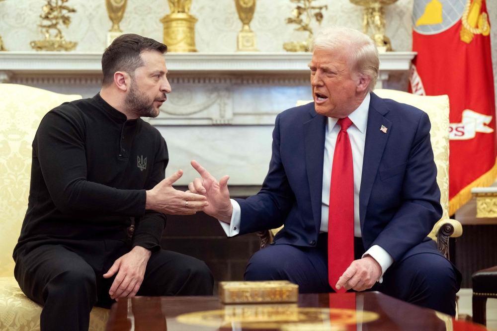 Donald Trump and Volodymyr Zelensky openly clashed in the White House yesterday where they were due to sign a deal on sharing Ukraine's mineral riches and discuss a peace deal with Russia. — Pic by AFP 